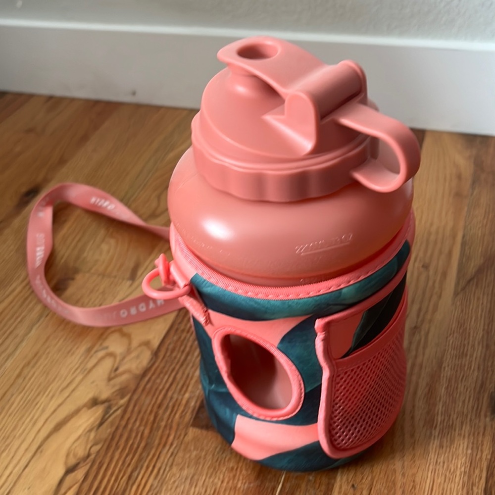 Pink hydro jug with palm leaf sleeve